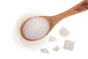 Wall Mural - granulated sugar in wooden spoon with cube isolated on white background. Top view. Flat lay