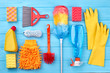 Cleaning stuff on blue wooden background. Set of cleaning products. Time for clean up.