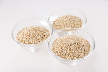 Wall Mural - Quinoa grains in bowl isolated on white background, Chenopodium quinoa