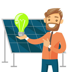 Wall Mural - Caucasian white engineer of solar power plant holding lightbulb on the background of solar panel. Renewable energy concept. Vector cartoon illustration isolated on white background. Square layout.