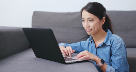 Wall Mural - Woman use of notebook computer at home