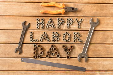 Wall Mural - Labor day.  Different tools on a wooden table