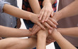 © Africa Studio - Young people putting hands together as symbol of unity