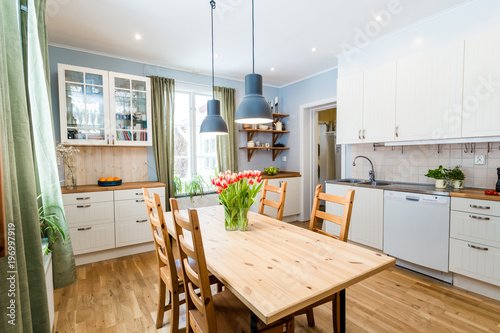 Cuadros en Lienzo kitchen interior with green curtains by the window tulips on the kitchen table