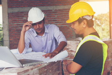 architect and engineer inspect housing estate building to success construction plan before send quality housing to customers ;Showing thumb up for good teamwork .