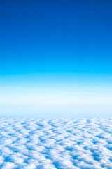 Wall Mural - blue sky and cloud top view from airplane window,nature background.