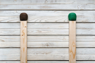 Two large matches on a wooden background. International Match Day.