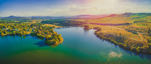 Aerial Panorama Of Beautiful Lake And Countryside At Sunset In Canberra, Australia