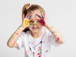 © Photocreo Bednarek - Little girl covered in paint making funny faces.