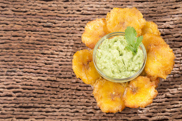 Canvas Print - Patacón fried flattened pieces of green plantain (tostón, tachino)