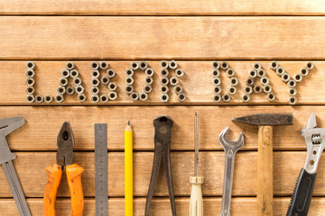 Wall Mural - Labor day.  Different tools on a wooden table