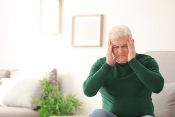 Poster - Mature man suffering from headache at home