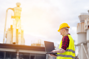 Wall Mural - Industrial worker using laptop