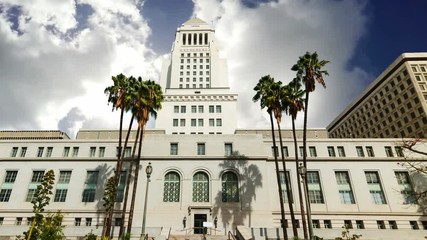 Wall Mural - Los Angeles city hall under a cloudy sky. Southern California, USA. Time lapse effect