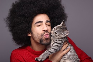 Afro man with a cat