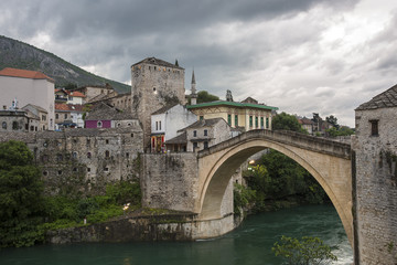 View of the single-arch Old Bridge or Stari Most Neretva over River in Mostar, Bosnia and Herzegovina. The Old Bridge was destroyed in 1993 by Croat military forces during the Croat–Bosniak War. 