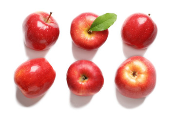 Ripe red apples on white background, flat lay