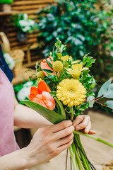 Canvas Print - Florist making beautiful bouquet at flower shop