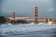 Storm on ocean bay in San Francisco city beach with Golden Gate Bridge view