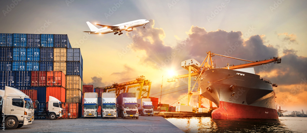 Logistics and transportation of Container Cargo ship and Cargo plane with working crane bridge in shipyard at sunrise, logistic import export and transport industry background - obrazy, fototapety, plakaty 