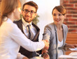 © ASDF - business woman greets the employee with a handshake,