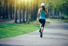 Sporty Fitness Woman Running At Park