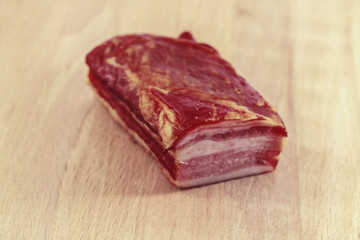 A piece of raw smoked meat