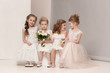 © master1305 - Little pretty girls with flowers dressed in wedding dresses