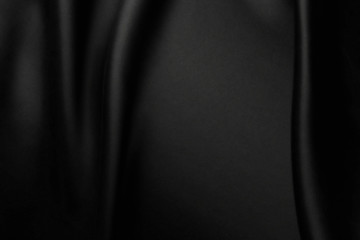 Elegant black satin silk with waves, texture background