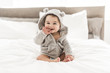canvas print picture - Portrait of a baby boy on the bed in bedroom