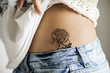 Closeup of hip tattoo on a woman