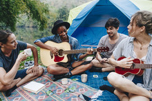 Group Of Young Adult Friends At Camp Site 