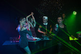 Fototapeta Sport - Party young people group dancing in night club