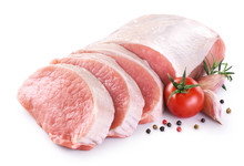 Raw Sliced Pork Loin With Tomato, Pepper, Rosemary And Garlic Isolated On White Background. Fresh Meat.