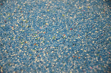 Texture Of A Colored Granular Sand Close Up. Blue Grains