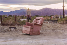 Old Pink Armchair In The Ruins Of Bombay Beach, Salton City, California, United States.