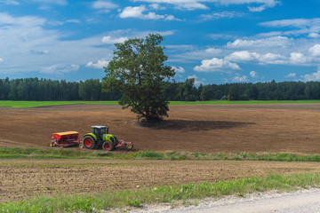 Wall Mural - A plowed field and a road.