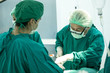 © Bavorndej - The surgery team working together at the operating room in the hospital.