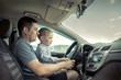 © Andrii IURLOV - Father and son driving in car