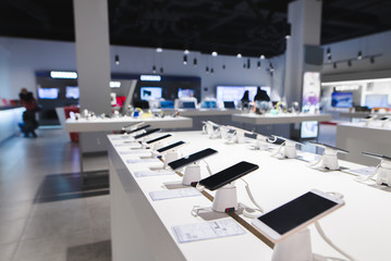 many smartphones are on the table in the technology store. buying a mobile phone at the electronics 