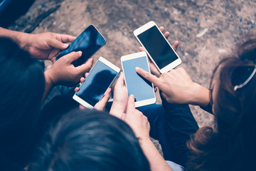group of people using smart phone for online shopping or ecommerce concept
