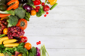 Vegetable and fruits on white wood background. Flat lay