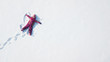 © 4Max - Child girl playing and making a snow angel in the snow. Top flat overhead view