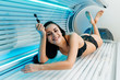 © mnelen.com - beautiful young girl lies in a sunroom and smiles, thinks of beauty, sunbaths under the ultraviolet rays