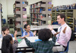 © Nattanon - Happy Children and teacher in Learning Class at Library. Boy raised hand up his hand to answer a question from teacher. Setup studio shooting.
