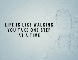 Wall Mural - Motivational and inspirational quotes - Life is like walking. You take one step at a time. With vintage styled background.
