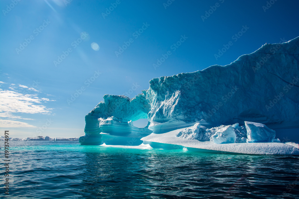Amazing shine of iceberg. Iceberg in Greenland - obrazy, fototapety, plakaty 