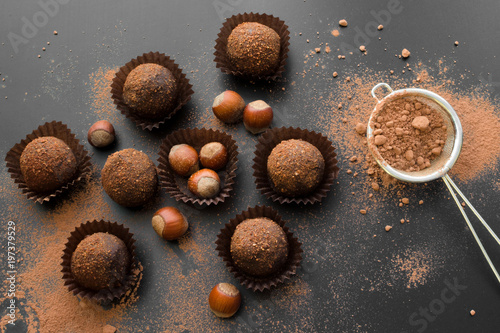 Fotografie, Obraz small chocolate petit fours with hazelnuts top view