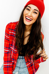 Happy brunette Girl. Smile and fashion urban vibes. Red colours trend