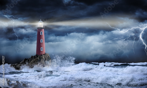 Obraz w ramie Lighthouse In Stormy Landscape - Leader And Vision Concept
